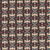 Windham Fabrics Copper Sky Kassie Kussman Onyx Black Grey Echo Flight fabric with a repeating pattern of stylized eagle and rainbow motifs in black, white, red, and blue colors.