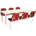 Six-Seater Canteen Rectangular Poly Shell Set DP6, Sturdy Table with Red Plastic Chairs Arranged Around It for Dining or Meetings.