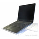 Acrylic Laptop Tablet Stand DP0401, Clear Acrylic Stand Holding a Black Laptop with a 120-degree Tilt Angle for Ergonomic Viewing.