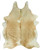 Caramel and white cowhide rug with soft natural pattern