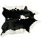Black and white spotted cowhide rug with bold contrast pattern