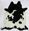 Black and white spotted cowhide rug with bold contrast pattern