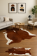 Brown &  White  Cowhide in Lounge  Setting
