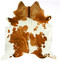 Hereford spotted cowhide rug with warm brown and white natural markings