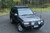 ARB Roof Rack Base with Mount Kit - Flat Rack with Wind Deflector - BASE201 Photo - lifestyle view