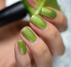 Live Wire Nail Polish, close-up of fingernails painted with vibrant green glitter nail polish.