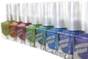Short Circuit Nail Polish, array of colorful nail polish bottles in shades of yellow, orange, pink, green, teal, blue, and purple with white caps.