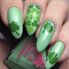 Dumb Luck Nail Polish, nail art featuring pastel green nails with green shamrock designs for St. Patrick's Day celebrations.