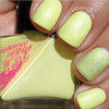 Law Of Nature Nail Polish, close-up image of fingernails painted with a luminous light green nail lacquer with a subtle shimmer.