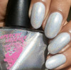Nothing Ventured Nail Polish, close-up of nails painted with iridescent, glittery white polish showing a sparkling finish.