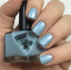 Coming Unblued Nail Polish, light blue shimmery nail polish on fingernails.
