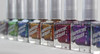 Crown Of Thorns Nail Polish, a collection of nail polish bottles with metallic and glitter finishes in various colors displayed in a row.