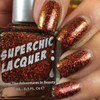 Crown Of Thorns Nail Polish, red and gold glittery nail polish on fingernails.