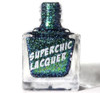 Heaven's Coordinates Nail Polish, a glittery nail polish bottle with blue and green sparkles inside.