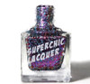 Quickening Nail Polish, glittery multicolor nail polish in a clear glass bottle with a silver cap and label reading 'Superchic Lacquer'.