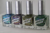 Skin Tight Nail Polish, four bottles of holographic nail lacquer with metallic silver caps displayed on a white surface.