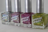Make It Work Nail Polish, set of four glittery nail polish bottles featuring black, pink, purple, and green shades with holographic sparkle.