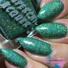 Take The Plunge Nail Polish, vibrant green glitter nail polish on manicured nails.