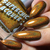 Rum-Billie Nail Polish, metallic gold and copper holographic nail polish with a shimmering, glittery finish.