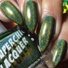 Awkward Turtle Nail Polish, close-up of holographic green and gold nail polish on fingernails.