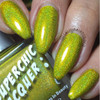 Pheromone Nail Polish, vibrant green holographic nail polish with glittery finish applied on fingernails.