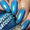 Dopamine Nail Polish, vibrant electric blue holographic nail polish with a sparkling glitter finish on manicured nails.