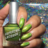Queen Of Tea Nail Polish, vibrant green holographic nail polish on fingers with a glittery rainbow background.