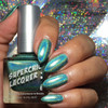Dirty Laundry Nail Polish, holographic metallic nail polish with a shiny, rainbow-like finish applied on manicured fingernails.