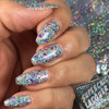 Sugar Buzz Nail Polish, close-up image of a hand with nails painted in glittery, multi-colored holographic nail polish.