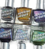 Juju Nail Polish, six bottles of colorful nail polish with holographic and glitter effects in silver, gold, purple, blue, and green shades.