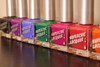 Amused Thermal Nail Polish, colorful bottles of thermal nail polish in various shades including purple, blue, green, pink, red, and orange displayed in a row.