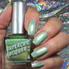 Germaphobe Nail Polish, holographic green nail polish shown on fingers with holographic background.