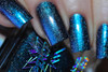 Second Star Right Till Morning Nail Polish, close-up of metallic blue glitter nail art on fingernails.