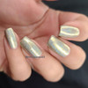 Hook Or By Crook Nail Polish, metallic holographic nail polish on neatly manicured nails.
