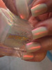 Whoopsie Daisies Nail Polish, iridescent pastel nail polish on fingernails.