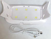 UV/LED Mini GEL Nail Lamp - 6W - Portable Curing Light, showing the compact white device with multiple LED lights and a USB power cable for quick gel nail curing.
