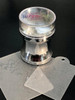 Clear Jelly Stamper - Nail Art Stamper, transparent jelly stamping tool with a design plate beneath on a black surface.