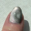 Rose Gold Tabby Holographic Multichrome Magnetic Cat Eye Topper Nail Polish, close-up of a fingernail painted with holographic and multichrome cat eye nail polish.