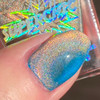Copper Bengal Holographic Multichrome Magnetic Cat Eye Topper Nail Polish, showcased on a fingernail with holographic multichrome finish.