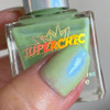 Boo Bag Halloween Nail Polish Set, green nail polish with shimmery finish held on a person's fingernail