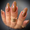 Party Booper Chocolate Halloween Nail Polish, close-up of a hand with oval-shaped nails painted with glittery, multicolored holographic nail polish.