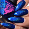 Lucid Lala Land Nail Polish, close-up of fingernails painted with shimmering blue nail polish with glitter accents.