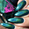 No Rest For The Wicked Nail Polish, close-up of turquoise and green holographic nails with glitter of the product on fingers.