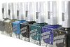 Crown Jewels Of Enchantment - Genuine Diamond Nail Polish, collection of colorful nail polish bottles with glittery and shimmering finishes.