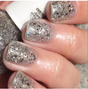 Crown Jewels Of Enchantment - Genuine Diamond Nail Polish, close-up of fingernails painted with sparkling glittery silver diamond-effect nail polish.