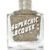 Chronicles Of The Dreamcatcher - Genuine Diamond Nail Polish, a clear square bottle filled with glittery gold nail lacquer with the label 'Superchic Lacquer' on the front.