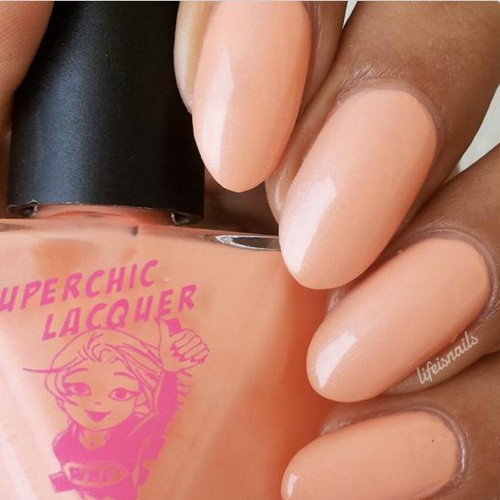 Cause & Effect Nail Polish, peach-colored nail polish on well-manicured fingernails.