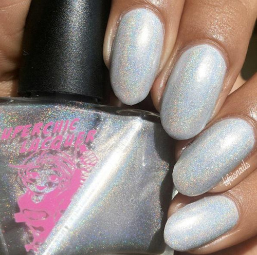 Nothing Ventured Nail Polish, close-up of nails painted with iridescent, glittery white polish showing a sparkling finish.