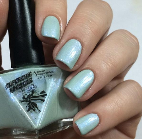 Figmint Of My Reality Nail Polish, light and shimmery pastel nail polish applied on fingernails.