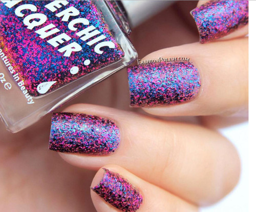 Entertaining Angels Nail Polish, close-up of nails painted with this colorful, glittery nail polish featuring pink, blue, and purple sparkles.